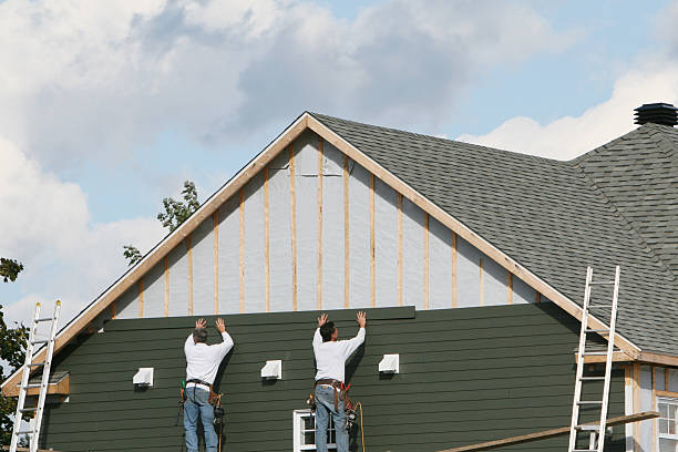 Professional Storm Damage Siding Repair technician working in North Canton, OH